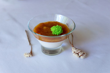 Panakota with berries. cherry in the juice