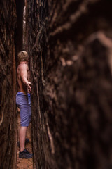 Squeezing Through a Slot Canyon Utah