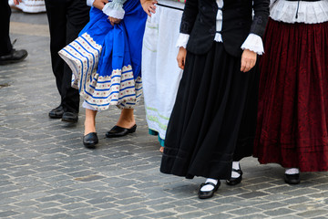 people weared with traditional Portuguese costumes at romeria