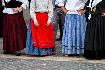 people weared with traditional Portuguese costumes at romeria