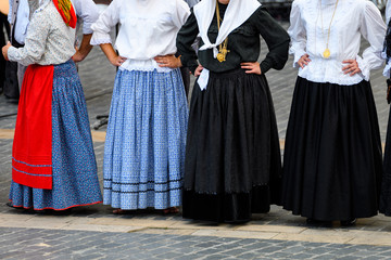 people weared with traditional Portuguese costumes at romeria