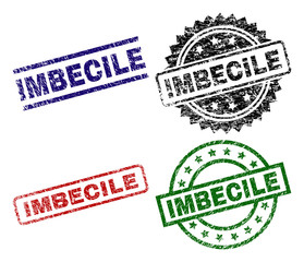 IMBECILE seal prints with damaged surface. Black, green,red,blue vector rubber prints of IMBECILE tag with retro surface. Rubber seals with circle, rectangle, medallion shapes.