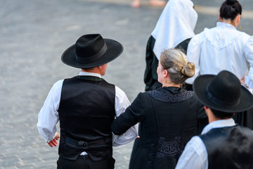 people weared with traditional Portuguese costumes at romeria © jon_chica