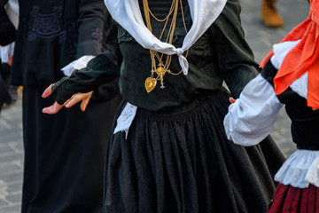people weared with traditional Portuguese costumes at romeria