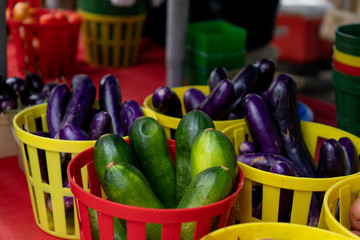 Eggplants and cucumber at the farmers market