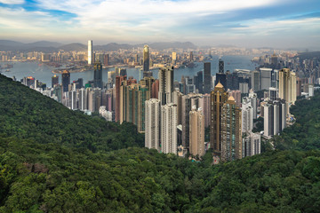 Hong Kong skyline and Victoria harbour seen from Victoria Peak at sunset.