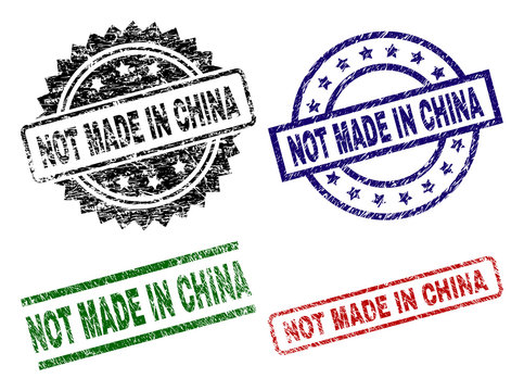 NOT MADE IN CHINA seal prints with damaged surface. Black, green,red,blue vector rubber prints of NOT MADE IN CHINA title with grunge surface. Rubber seals with circle, rectangle, rosette shapes.