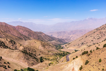 Kamchik Pass viewpoint overlooking Qurama Mountains - Uzkbekistan. The pass provides a strategically important route as an access Tashkent and the Fergana Valley.