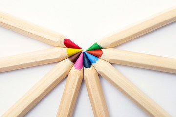 colored pencils on a white background