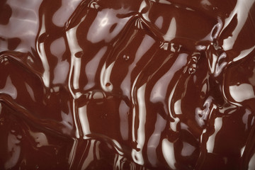 Melted chocolate swirl as a background closeup