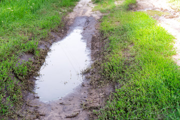 The dirt on the roads after a heavy rain.