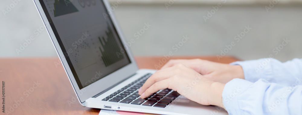 Poster closeup banner website work with finance analysis and planing data on laptop, typing and paper graph