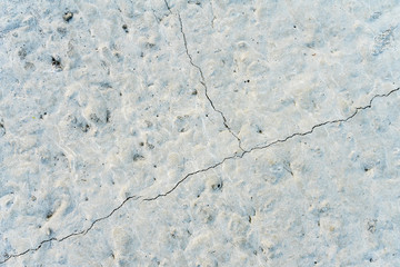 Solidified building concrete with small cracks. Background.