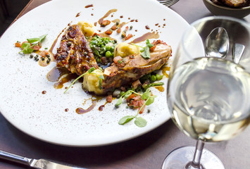 Chicken Dinner and Wine on a Restaurant Table