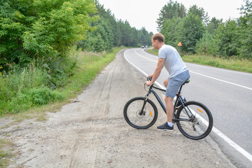 the athlete moves the roadway on a Bicycle.Healthy lifestyle.Walking by bike