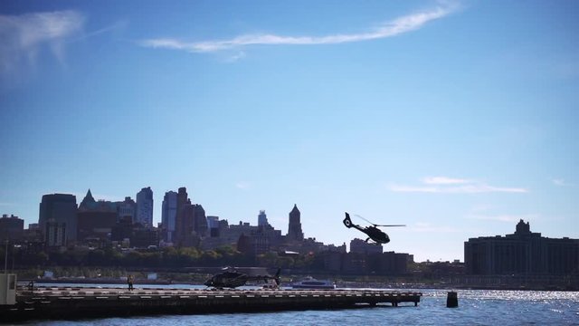 Slow motion video of an Helicopter that is taking off from an airstrip in Manhattan, New York, Usa.
