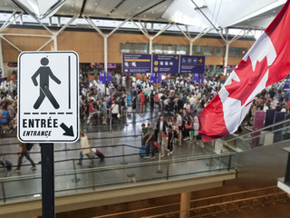 Entrance sign post at Canadian airport custom counters, returning home concept