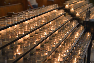 Votive candles flickering in Louisiana church