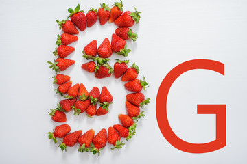 emblem 5g made up of fresh strawberries