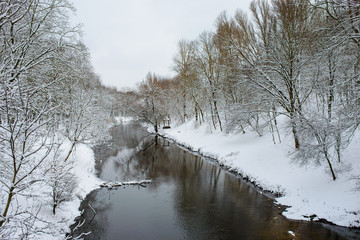 Winter landscape with the river in frosty day