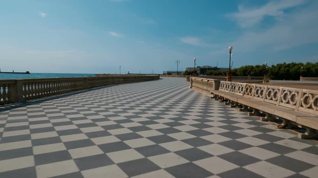 Establishing shot of the exquisite Terrazza Mascagni in the amazing Tuscan city of Livorno, Italy. Built in the 1920s, the Terrazza is a chequered belvedere facing the sea with 8,700 sq. m.