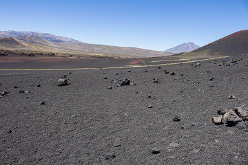Fototapeta na wymiar Volcanic field full of lava of different colors.
