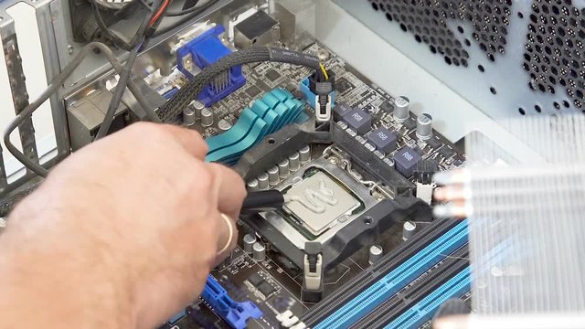 Add Thermal paste Fix Repair  in the Computer pc CPU coller.A Close up.