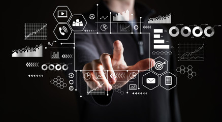 Marketing concept with businessman on a black background 