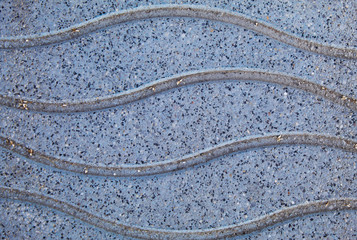 Wavy lines on a boardwalk on a beach in Spain