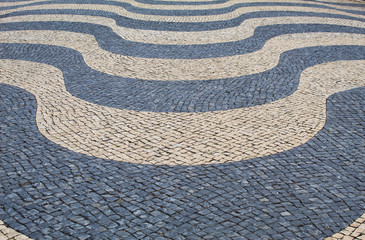 Mosaic tiles in wavy pattern in Lisbon, Portugal