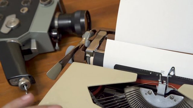 Writing a Screenplay on a retro typewriter. 80s Closeup