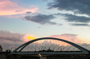 Fototapeta na wymiar Sunset behind Goodwill Bridge - pedestrian and cyclist bridge that spans the Brisbane River