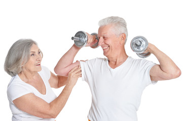 smiling senior couple exercising