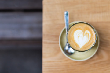 A glass of cappuccino on the table