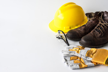 Construction site safety. Personal protective equipment on white background. Free space for text