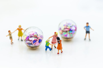 Miniature people : children playing together. Image use for happy family day concept.