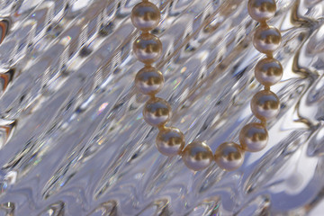 Macro abstract background of pearls draped over fine quality lead crystal glass with wavy diagonal design