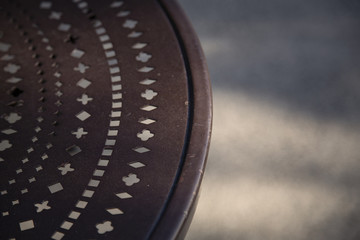 Isolated View of Decorative Wrought iron Work Against Out of Focus Background