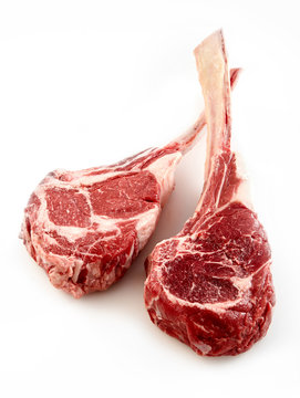 Two thick bone-in tomahawk or ribeye steaks