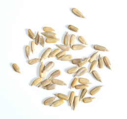 Sunflower seeds, peeled on white background