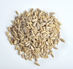 Sunflower seeds, peeled on white background