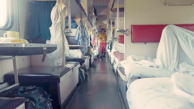 Lying down on bed in train, medium shot, shallow DOF