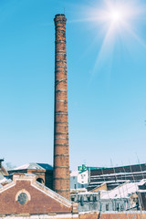 Old factory chimney against the sky