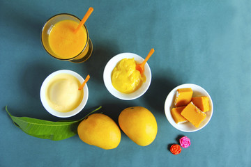 Top view showing alphonso mango and its by-products like sweet, ice cream and shake