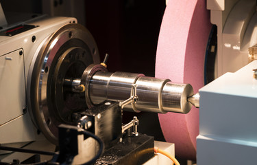 operator grinding mold and die part by universal grining machine in factory_01