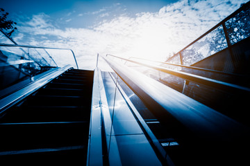 Fototapeta premium The elevator against the blue sky and cloud of a city outdoor