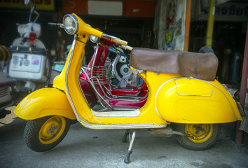 old yellow scooter in the shop