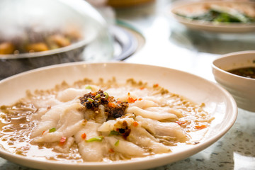 Steamed fish, gourmet background.