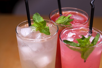 Three various summer milkshakes in glasses