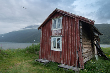Obraz premium Old rustic buildings in coastal Norway in fishing village